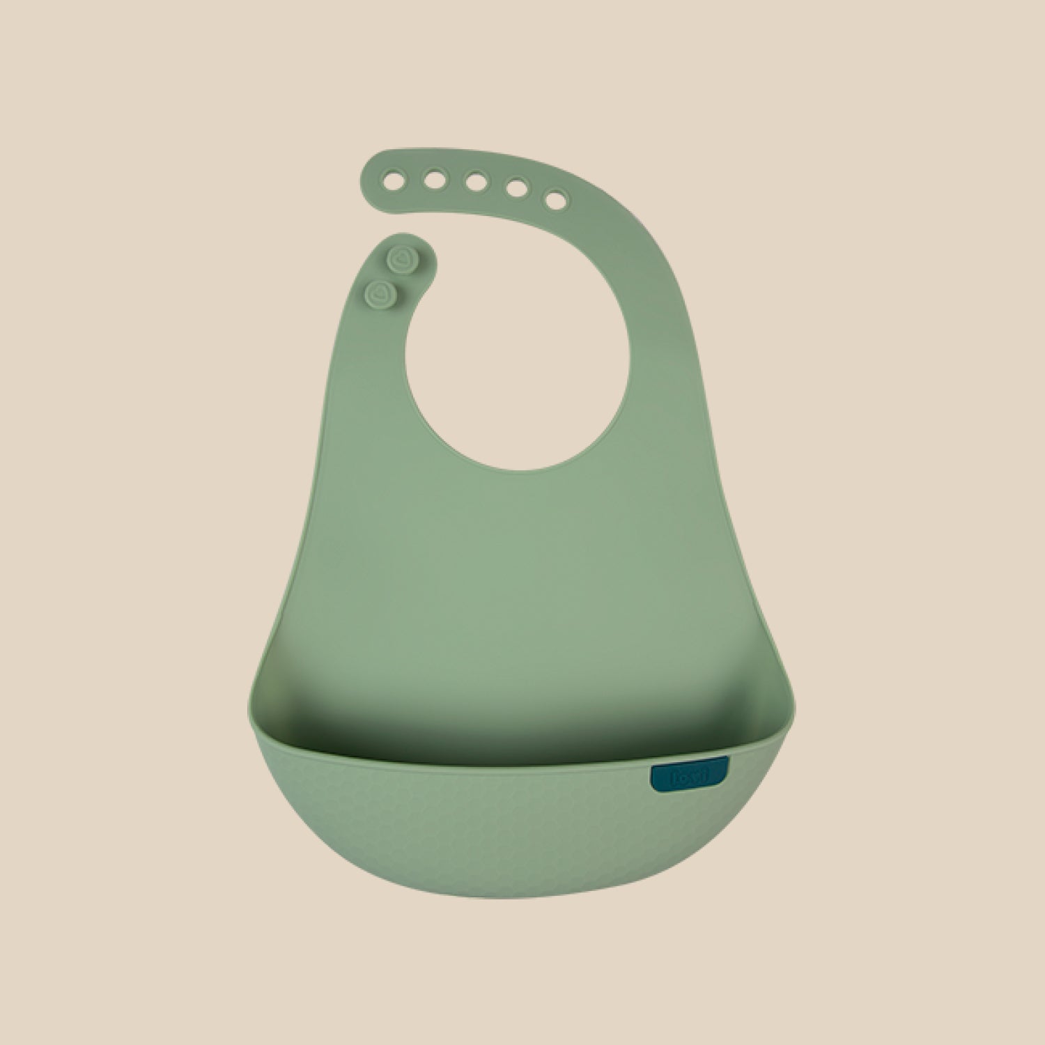 Bavoir en silicone coloris pistache pour bébé, idéal pendant les repas